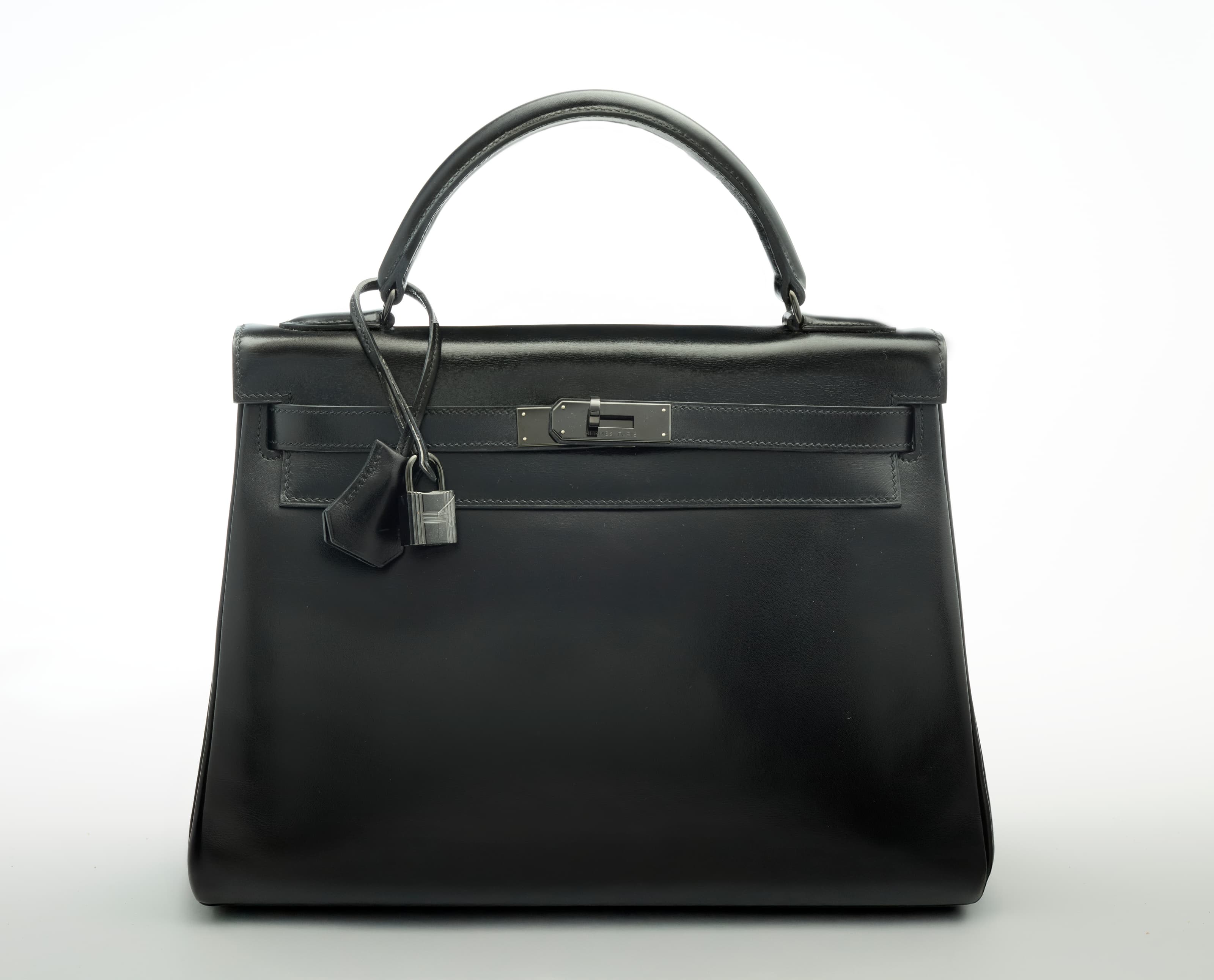 A LIMITED EDITION BLACK CALF BOX LEATHER RETOURNE SO BLACK KELLY 32 WITH BLACK PVD HARDWARE HERMES, 2010